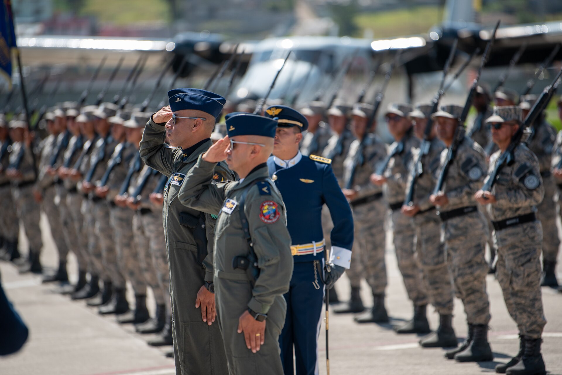 Ecuadorian Air Force members render salutes during a ceremony welcoming the arrival of a C-130H Hercules to the Ecuadorian Air Force in Latacunga, Ecuador, March 25, 2024. The ceremony, which included top Ecuadorian military and civilian leaders, marked a new milestone in Ecuador’s participation in the National Guard Bureau State Partnership Program, which has paired Ecuador and the Kentucky National Guard for mutual military cooperation. (U.S. Air National Guard photo by Phil Speck)