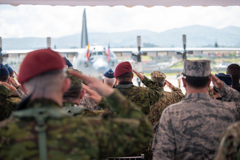 Ecuadorian Armed Forces members salute during a ceremony welcoming the arrival of a C-130H Hercules to the Ecuadorian Air Force in Latacunga, Ecuador, March 25, 2024. The ceremony, which included top Ecuadorian military and civilian leaders, marked a new milestone in Ecuador’s participation in the National Guard Bureau State Partnership Program, which has paired Ecuador and the Kentucky National Guard for mutual military cooperation. (U.S. Air National Guard photo by Phil Speck)