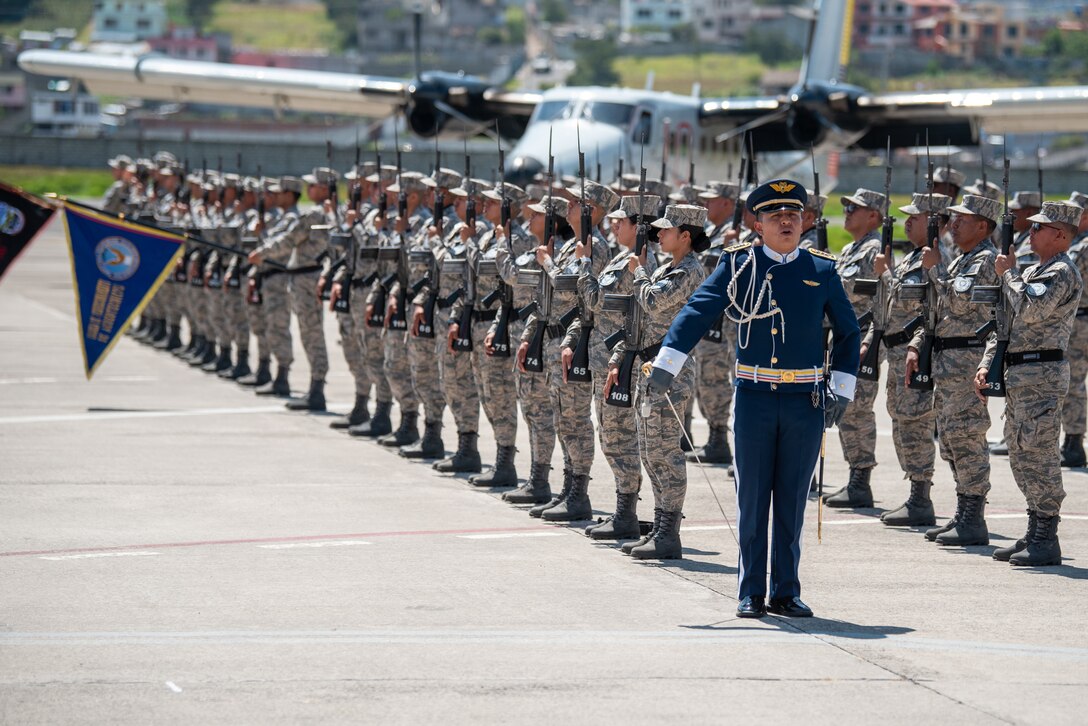 Ecuadorian Armed Forces members salute during a ceremony welcoming the arrival of a C-130H Hercules to the Ecuadorian Air Force in Latacunga, Ecuador, March 25, 2024. The ceremony, which included top Ecuadorian military and civilian leaders, marked a new milestone in Ecuador’s participation in the National Guard Bureau State Partnership Program, which has paired Ecuador and the Kentucky National Guard for mutual military cooperation. (U.S. Air National Guard photo by Phil Speck)