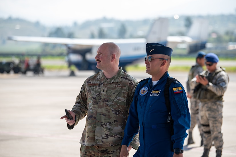 1st Lt. Jason Sanderson, left, director of plans and requirements for the Kentucky Air National Guard, and Capt. Ivan Torres, chief of the Ecuadorian Air Force’s 11th Wing Scheduled Maintenance, talk prior to a ceremony welcoming the arrival of a C-130H Hercules to the Ecuadorian Air Force in Latacunga, Ecuador, March 25, 2024. The ceremony, which included top Ecuadorian military and civilian leaders, marked a new milestone in Ecuador’s participation in the National Guard Bureau State Partnership Program, which has paired Ecuador and the Kentucky National Guard for mutual military cooperation. (U.S. Air National Guard photo by Phil Speck)
