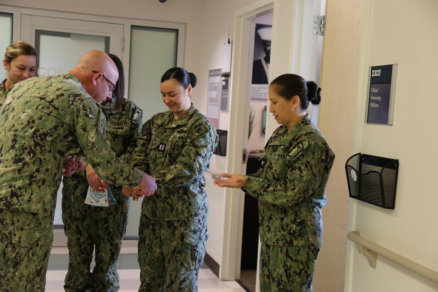 Naval Health Clinic Lemoore kicked off Nurses Week on May 6 with the Blessing of the Hands.  This year, the chaplain from Carrier Air Wing (CVW) 17, Lt. Kurt Hagestuen walked around the clinic blessing the hands of participating nurses. The Blessing of the Hands is a non-denominational ritual where a chaplain or spiritual leader blesses or anoints the hands of each nurse.  



From right to left: Nurses who provide care at Naval Health Clinic Lemoore, Capt. Vavadee Belko, Lt. Nanilei Parentau  Lt. jg. Terra Colangeli and Lt. jg. Brooke Riordan.  Left: Chaplain Lt. Kurt Hagestuen, Carrier Air Wing 17.

(DoD photo by Elaine Heirigs/released)