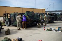 U.S. Army Soldiers assigned to the 43rd Multi-Role Bridge Company, 20th Engineer Battalion, inspect a Joint Light Tactical Vehicle at Drawsko  Combat Training Center, Poland, April 29, 2024. The JLTV was brought to DCTC by the Army Field Support Battalion-Benelux to be issued to Soldiers before they participate in DEFENDER 24. (U.S. Army photo by Staff Sgt. Rene Rosas)