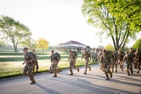 Soldiers competing in the 2024 Region IV Best Warrior Competition begin a 12-mile ruck march at Camp Dodge in Johnston, Iowa, May 5, 2024. The Soldiers completed the ruck as the final event of the competition testing physical endurance, mental toughness, leadership, and analytical and decision-making skills.