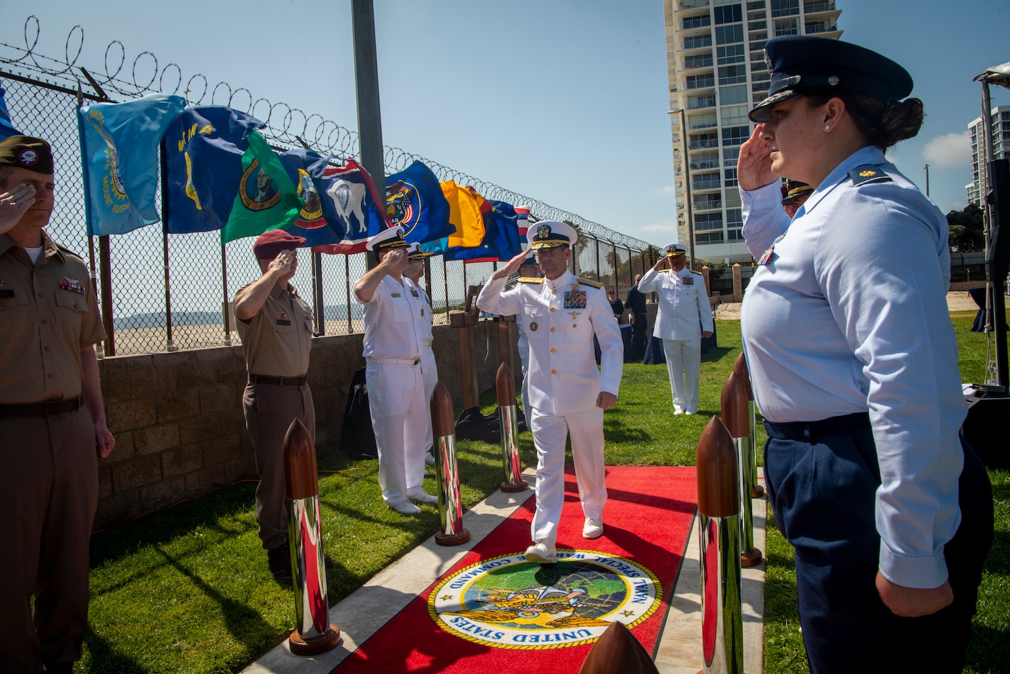 Rear Adm. Keith Davids, commander, Naval Special Warfare Command (NSWC), passes through sideboys during a retirement ceremony at NSWC in honor of Vice Adm. Collin Green, Deputy Commander of U.S. Special Operations Command.