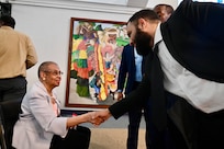 Hector Lamas, assistant lead recruiter, Capital Guardian Youth ChalleNGe Academy, greets Rep. Eleanor Holmes Norton prior to a D.C. Commission on Black Men and Boys meeting in Washington, D.C, April 30, 2024. The commission seeks solutions to disparities affecting Black men and boys in the District to include social conditions, crime and incarceration rates.