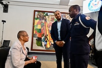 Cadet William Thomas, a current member of CGYCA Class 62, greets Rep. Eleanor Holmes Norton before a D.C. Commission on Black Men and Boys meeting in Washington, D.C, April 30, 2024. The commission seeks solutions to disparities affecting Black men and boys in the District to include social conditions, crime and incarceration rates.