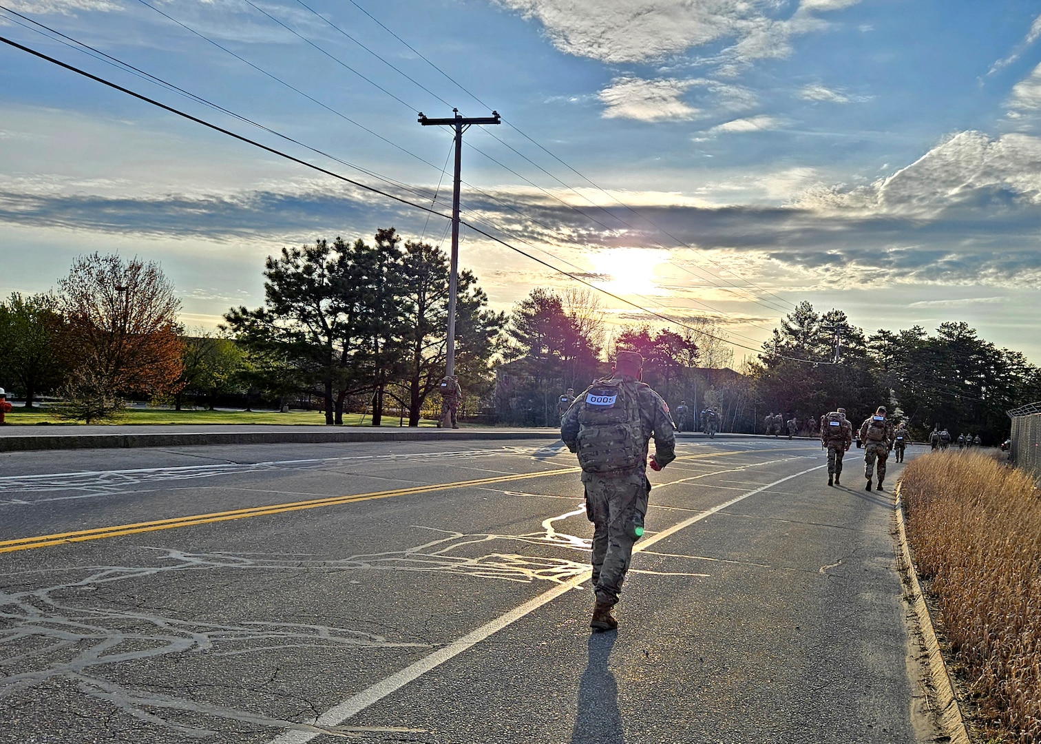 Sixty-one New Hampshire Guardsman embark at sunrise for the 18.6-mile Norwegian Foot March on May 4, 2024, from the Army Aviation Support Facility in Concord, N.H.
