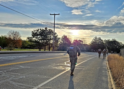 Sixty-one New Hampshire Guardsman embark at sunrise for the 18.6-mile Norwegian Foot March on May 4, 2024, from the Army Aviation Support Facility in Concord, N.H.