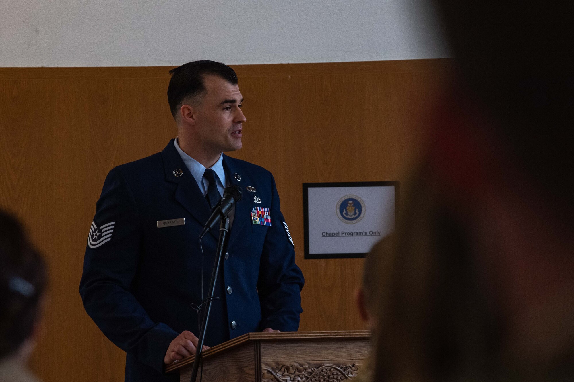 A man talks at a podium