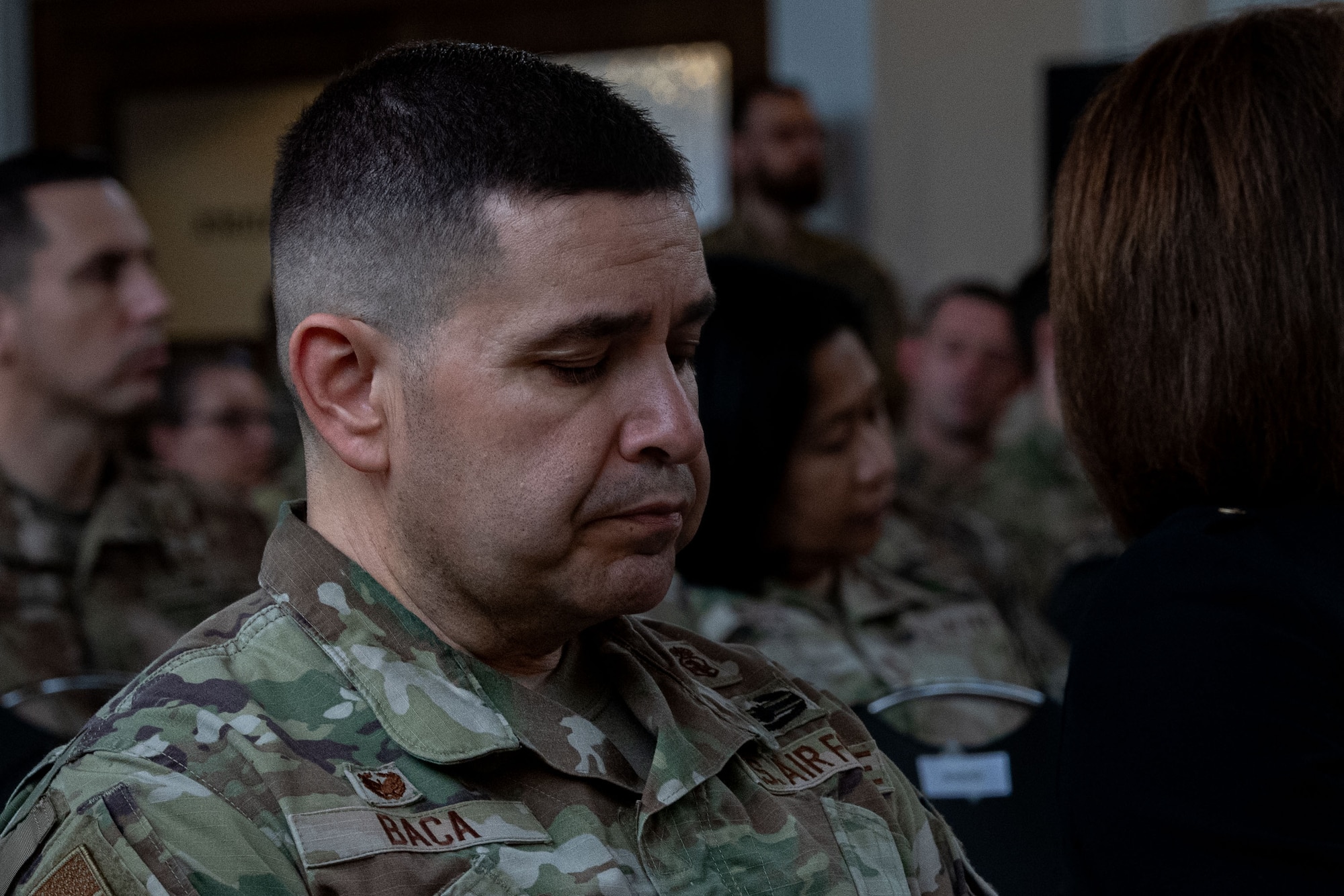 A man sits at a ceremony