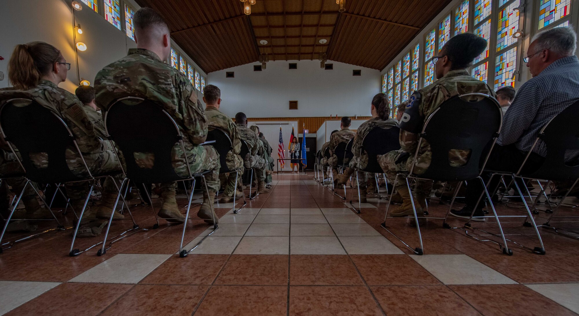 People sit down at a ceremony