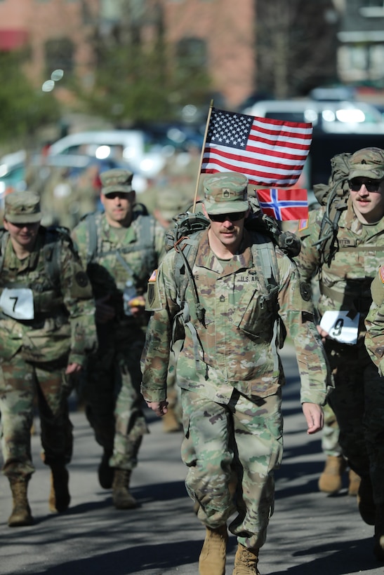 Wisconsin National Guard service members participating in the Norwegian foot march take off from the starting point at the Glacial Drumlin State Trail on April 19, 2024. The Norwegian foot march challenges participants to complete 30 kilometers (18.6 miles) while carrying at least 24 pounds in a rucksack on their back. (U.S. National Guard photo by Staff Sgt. Amber Peck)