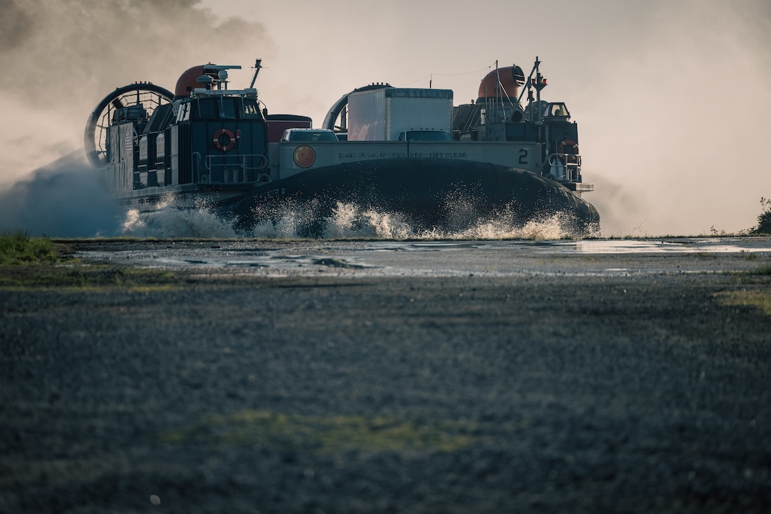 A U.S. Navy Landing Craft Air Cushion conducts a beach landing during the Annual Amphibious Mobility Exercise at Marine Corps Air Facility on Marine Corps Base Quantico, Virginia, May, 3, 2024. The LCAC is a class of air-cushioned landing craft used by the Navy to transport weapons systems, equipment, cargo and personnel from ship to shore and across the beach. (U.S. Marine Corps photo by Lance Cpl. Ethan Miller)