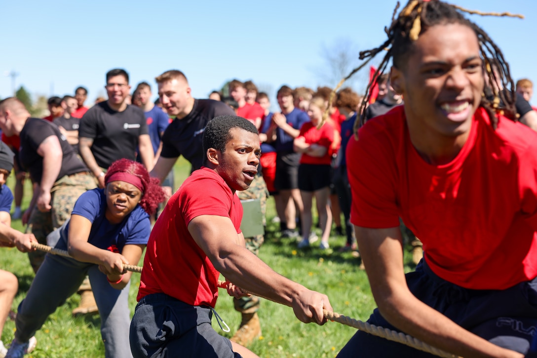 Recruiting Station (RS) Ohio poolees give their all to a tug of war challenge during RS Ohio's annual pool function at Rickenbacker Air National Guard Base, Columbus, Ohio, April 12, 2024.  The purpose of the event is to prepare poolees for recruit training, build morale, and answer any questions families may have about the Marine Corps.  (U.S. Marine Corps photo by Sgt. Bernadette Pacheco)