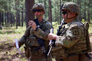 Sgt. 1st Class John Iseman, left, and Sgt. Jesus Calixto, explosive rrdnance disposal technicians with the 1108th Ordnance Company, discuss their strategy during the 2024 All-Army EOD Team of the Year competition in Fort Liberty, N.C., April 21-26. Iseman and Calixto represented the Army National Guard.