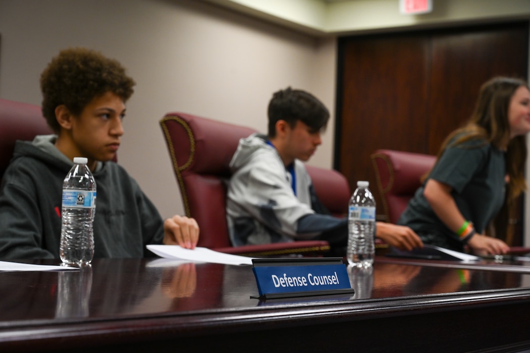 Students from Mangum High School portray a defense council at Altus Air Force Base, Oklahoma, May 1, 2024. The defense council assisted the lawyer and worked to protect the rights of the person they represented. (U.S. Air Force photo by Airman Lauren Torres)