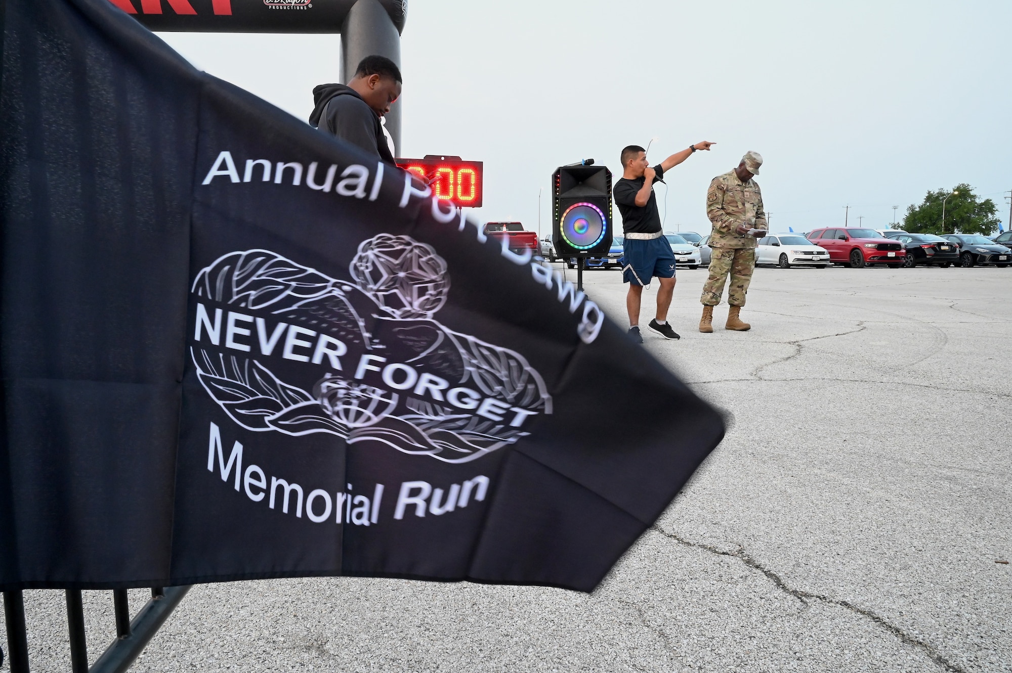 Tech. Sgt. Erik Burciaga, 74th Aerial Port Squadron air transportation supervisor, speaks to participants ahead of the Annual Port Dawg Memorial Run at Joint Base San Antonio-Lackland, Texas, May 5, 2024.