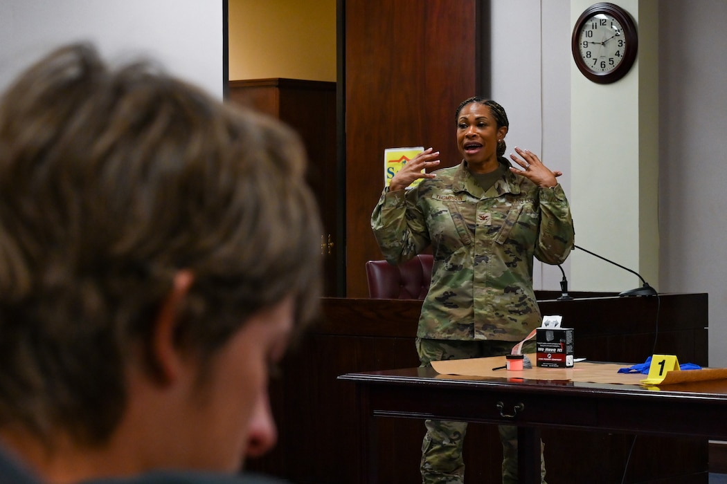 U.S. Air Force Col. Velma Thompson, 97th Air Mobility Wing staff judge advocate, talks to Mangum High School students at Altus Air Force Base, Oklahoma, May 1, 2024. Thompson explained the importance of Law Day to the students and gave insight into how the mock trial would go. (U.S. Air Force photo by Airman Lauren Torres)