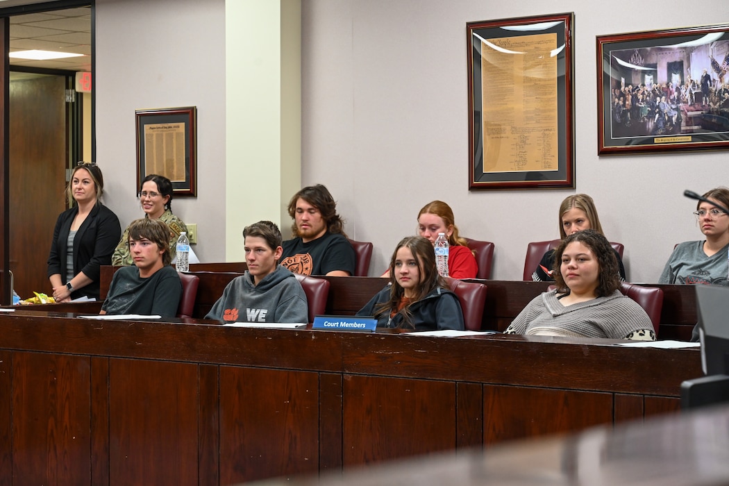 Students from Mangum High School sit in a courtroom at Altus Air Force Base, Oklahoma, May 1, 2024. During the mock trial, students portrayed a jury in order to come up with a verdict. (U.S. Air Force photo by Airman Lauren Torres)