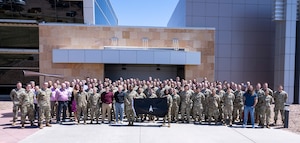 Participants of SPACE FLAG 24-1 pose for a group photo at Schriever Space Force Base, Colo., April 19, 2024. This event saw the participation of nearly 400 individuals focusing on space mission integration planning. (U.S. Space Force photo by Judi Tomich)