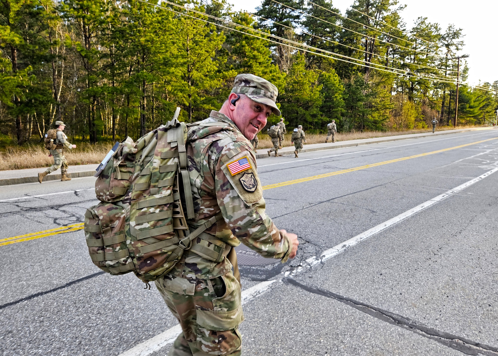 Sgt. 1st Class Rick Frost, 195th Regional Training Institute, New Hampshire Army National Guard, dashes from the starting point of a Norwegian Foot March May 4, 2024, in Concord, New Hampshire. Of 61 competitors, Frost was one of 39 to successfully complete the 18.6-mile event in time allotments that varied by competitor age and gender.
