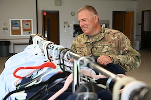 U.S. Air Force Tech. Sgt. John Joe, a cargo supervisor with the 514th Air Mobility Wing, 88th Aerial Port Squadron, browses uniform items at a blues exchange drive at the McGuire Chapel, Joint Base McGuire-Dix-Lakehurst, N.J. on May 4, 2024.