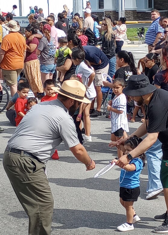 Jacksonville District Park Ranger hands out water safety material at local parade.