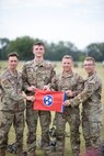 Four Tennessee National Guard Soldiers from Ashland City’s Troop B, 1st Squadron, 278th Armored Cavalry Regiment, won first place during the prestigious 2024 Sullivan Cup competition at Fort Moore, Georgia, April 29 to May 3, 2024. Staff Sgt. David Riddick, Sgt. Joshua Owen, Spc. Noah Eddings, and Spc. Seth Carter hold a Tennessee flag after defeating 10 other teams from active-duty Army units and four allied nations in a head-to-head competition to test a crew's maneuver, sustainment and gunnery skills to earn the honor of being the best tank crew.