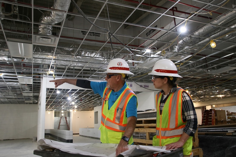 As a resident engineer for the U.S. Army Corps of Engineers, Daniel Olivas has coordinated many construction projects, but the Airman Training Centers show the strength and innovation of USACE. Olivas goes over the blueprints for the dining facility, another project underway in conjunction with ATC #6.