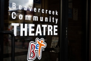 A sign is pictured of the words "Beavercreek Community Theatre" and logo.