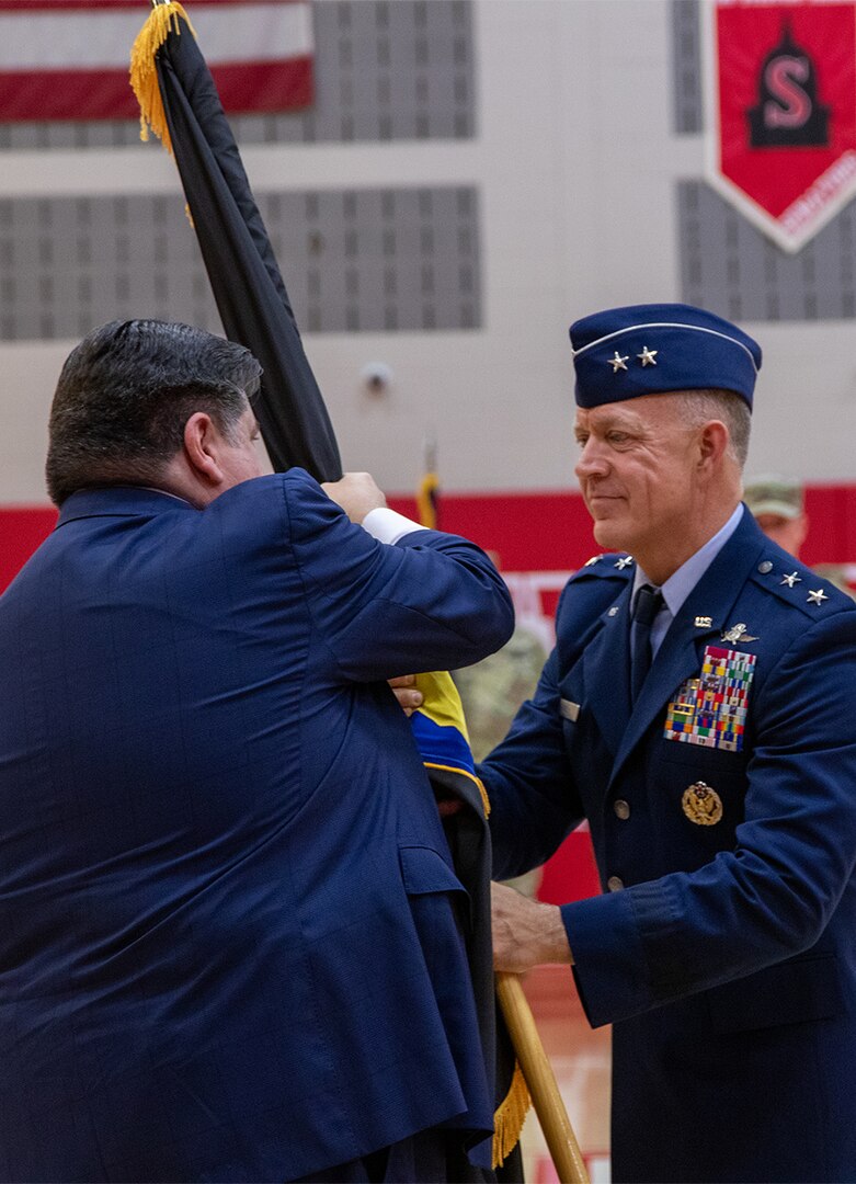 Maj. Gen. Rich Neely, the 40th Adjutant General of Illinois, relinquishes command of the Illinois National Guard to Governor JB Pritzker during a change of command ceremony May 4 at Glenwood High School in Chatham, Illinois. Following the change of command, Neely retired from the Illinois National Guard after 40 years of military service.