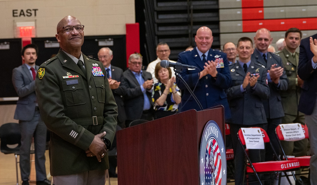 Maj. Gen. Rodney Boyd receives a standing ovation prior to his remarks during a change of command ceremony May 4 at Glenwood High School in Chatham, Illinois. With Boyd’s assumption of command, he becomes the first Black officer and person of color to lead the 13,000 Soldiers and Airmen in the Illinois National Guard.