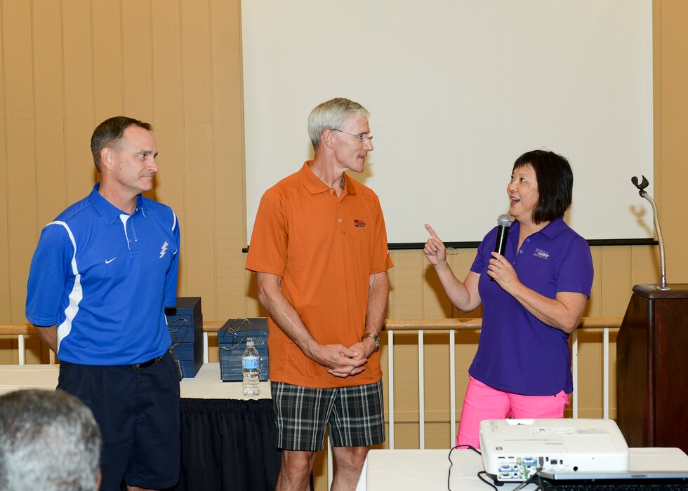 U.S. Air Force retired Maj. Gen. H. D. Polumbo (left), U.S. Air Force retired Lt. Gen. Robert Otto, and Janice Nall speak at the Beale Military Liaison Council Golf Tournament at Peach Tree Golf and Country Club, in Marysville, California, Sept. 6, 2013.