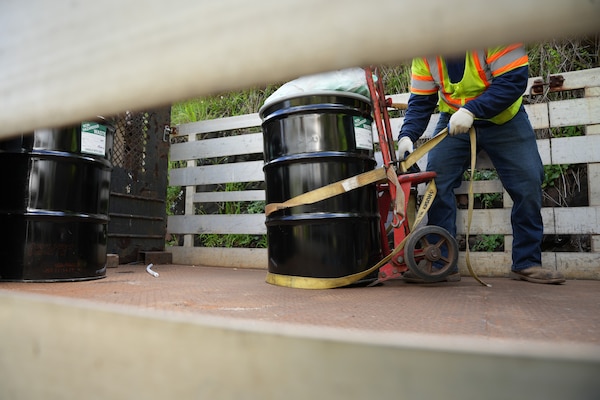 HAWALA, Hawaii (April 23, 2024) A Navy Closure Task Force-Red Hill (NCTF-RH) contractor loads a barrel of aqueous film-forming foam (AFFF) concentrate onto a truck outside the Red Hill Bulk Fuel Storage Facility (RHBFSF) in Halawa, Hawaii, April 23, 2024. NCTF-RH removed thirty-two 55-gallon barrels which will be transported to a treatment facility off island for disposal. Charged with the safe decommissioning of the RHBFSF, NCTF-RH was established by the Department of the Navy as a commitment to the community and the environment. The Navy continues to engage with the people of Hawaii, regulatory agencies, and other stakeholders as NCTF-RH works to safely and deliberately decommission the RHBFSF. (U.S. Navy photo by Mass Communication Specialist 1st Class Glenn Slaughter)