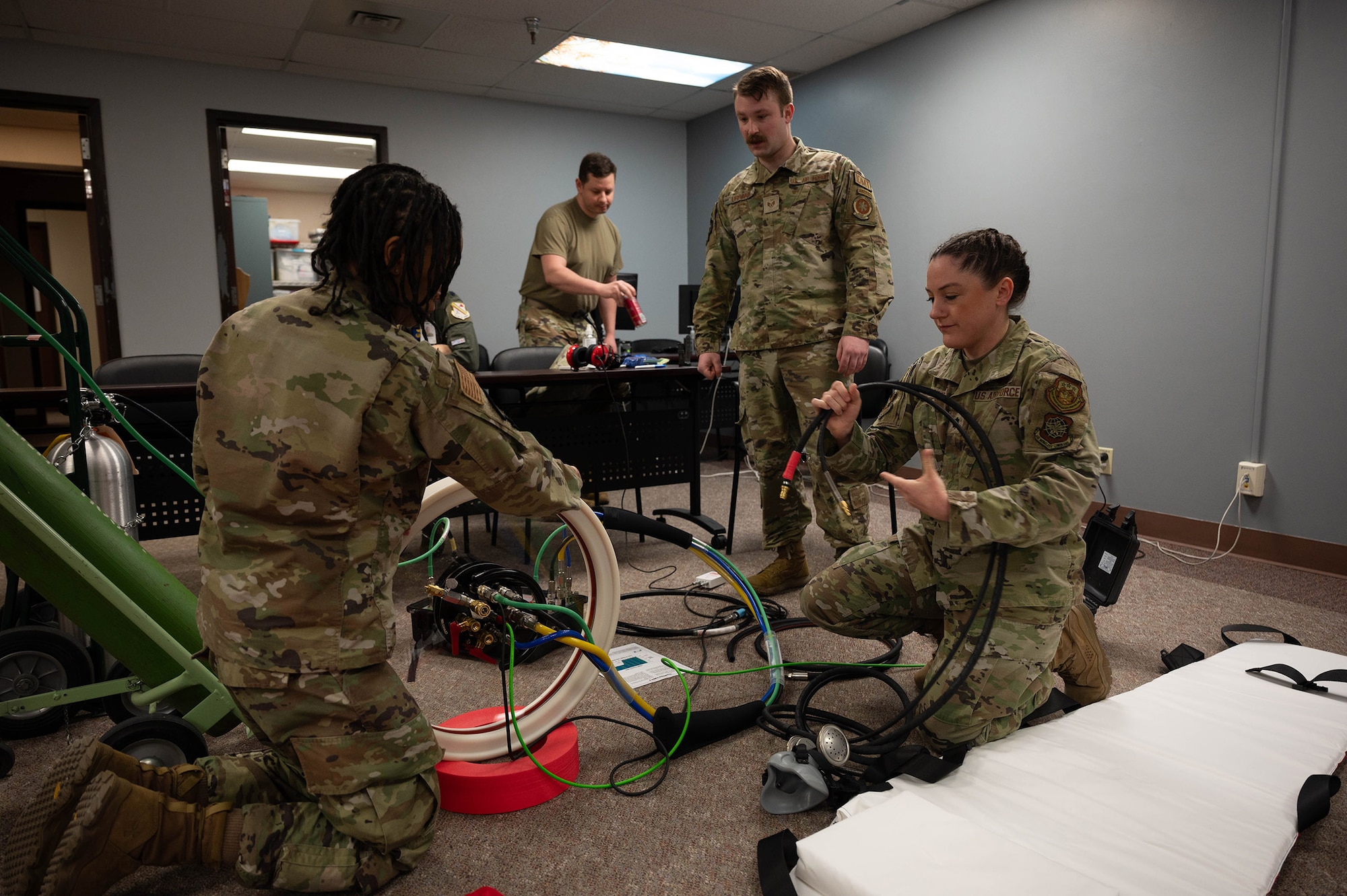 Airmen from the 354th Medical Group set up a portable decompression sickness chamber, Hyperlite 1, during a hyperlite chamber training exercise at Eielson Air Force Base, Alaska, May 3, 2024.
