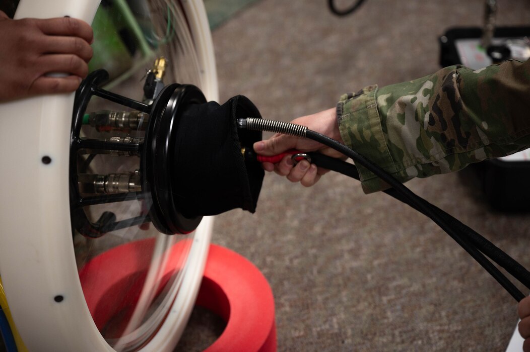 Airmen from the 354th Medical Group set up a portable decompression sickness chamber, Hyperlite 1, during a hyperlite chamber training exercise at Eielson Air Force Base, Alaska, May 3, 2024.