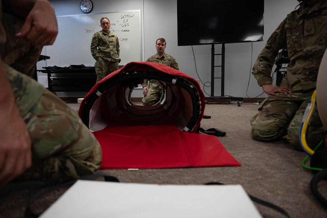 Airmen from the 354th Medical Group inflate a portable decompression sickness chamber, Hyoerlite 1, during a three-day hyperlite chamber training course at Eielson Air Force Base, Alaska, May 3, 2024.