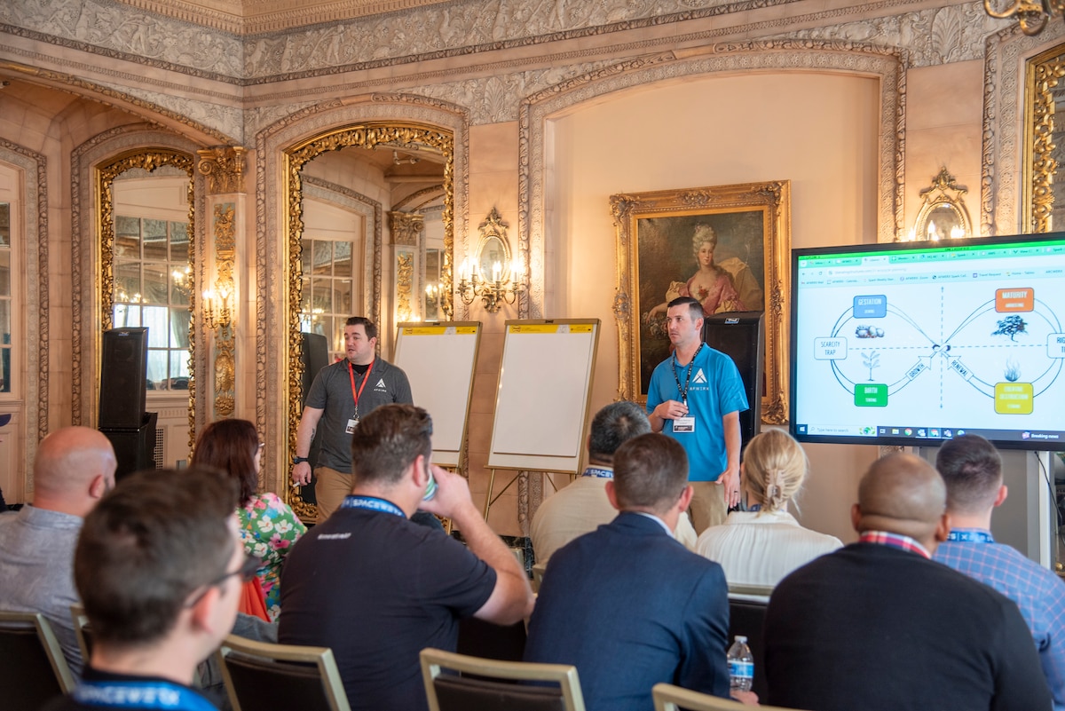 Staff Sgt. Joshua Nash, left, and Master Sgt. Dakota Belcher, AFWERX Spark coordinators, use Design Thinking methods to create conditions for lively participation and peak creativity of thought at the Western Crossflow event in Spokane, Washington, from April 23-25, 2024.