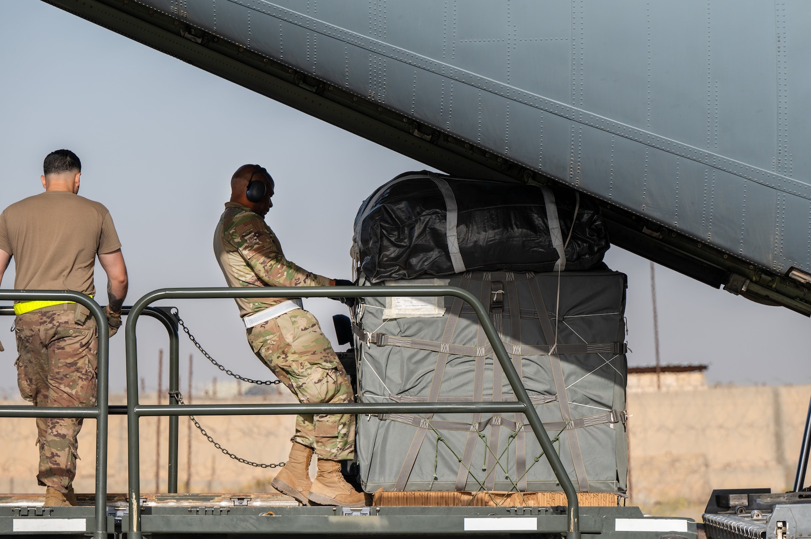 A U.S. Air Force port operations Airman loads pallets of humanitarian aid onto a C-130J Super Hercules at an undisclosed location within the U.S. Central Command area of responsibility, May 7, 2024. The U.S. Air Force’s rapid global mobility capability enables the expedited movement of critical, life-saving supplies to Gaza. (U.S. Air Force photo)