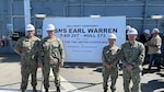 From left to right, Cmdr. Mark Ewachiw, Supervisor of Shipbuilding, Bath - San Diego Detachment, Officer in Charge;  Lt. Elliot Collins, Project Officer; Lt. Allison Adamos, Project Officer; and Lt. Cmdr. René Martin, T-AO Program Manager Representative attend the USNS Earl Warren (T-AO 207) Delivery Ceremony, in San Diego, Calif., May 7, 2024.