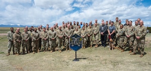 Leaders from across the geographically separated Space Base Delta 1 pose for a group photo outside in front of the Rocky Mountains at Schriever Space Force Base, Colorado, May 7, 2024.