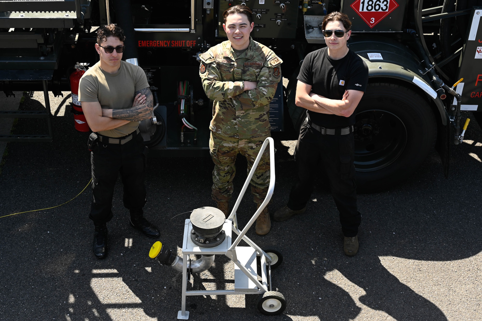 Three Airmen pose for a photo.