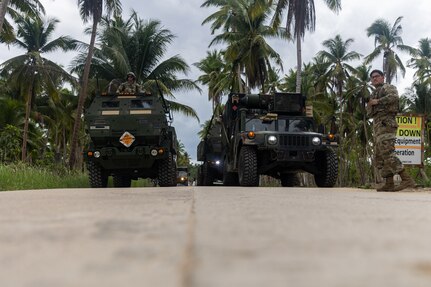 U.S. Army Soldiers with 3rd Platoon, Alpha Battery, 1st Long Range Fires Battalion, 1st Multi-Domain Task Force, prepare to load an M142 High Mobility Rocket System onto a U.S. Navy Landing Craft, Air Cushion 8, attached to Amphibious Craft Unit 5, during Exercise Balikatan 24 at San Vicente, Philippines, May 1, 2024. BK 24 is an annual exercise between the Armed Forces of the Philippines and the U.S. military designed to strengthen bilateral interoperability, capabilities, trust, and cooperation built over decades of shared experiences. (U.S. Marine Corps photo by Cpl. Kyle Chan)