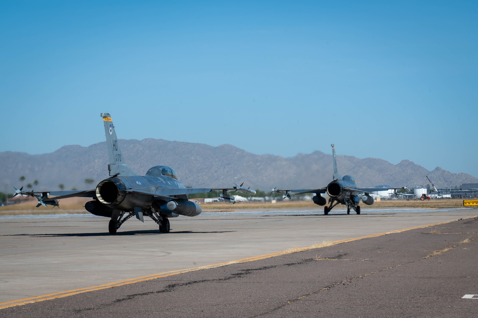U.S. Air Force F-16 Fighting Falcon aircraft assigned to the 309th Fighter Squadron taxi to the runway, May 7, 2024, at Luke Air Force Base, Arizona.