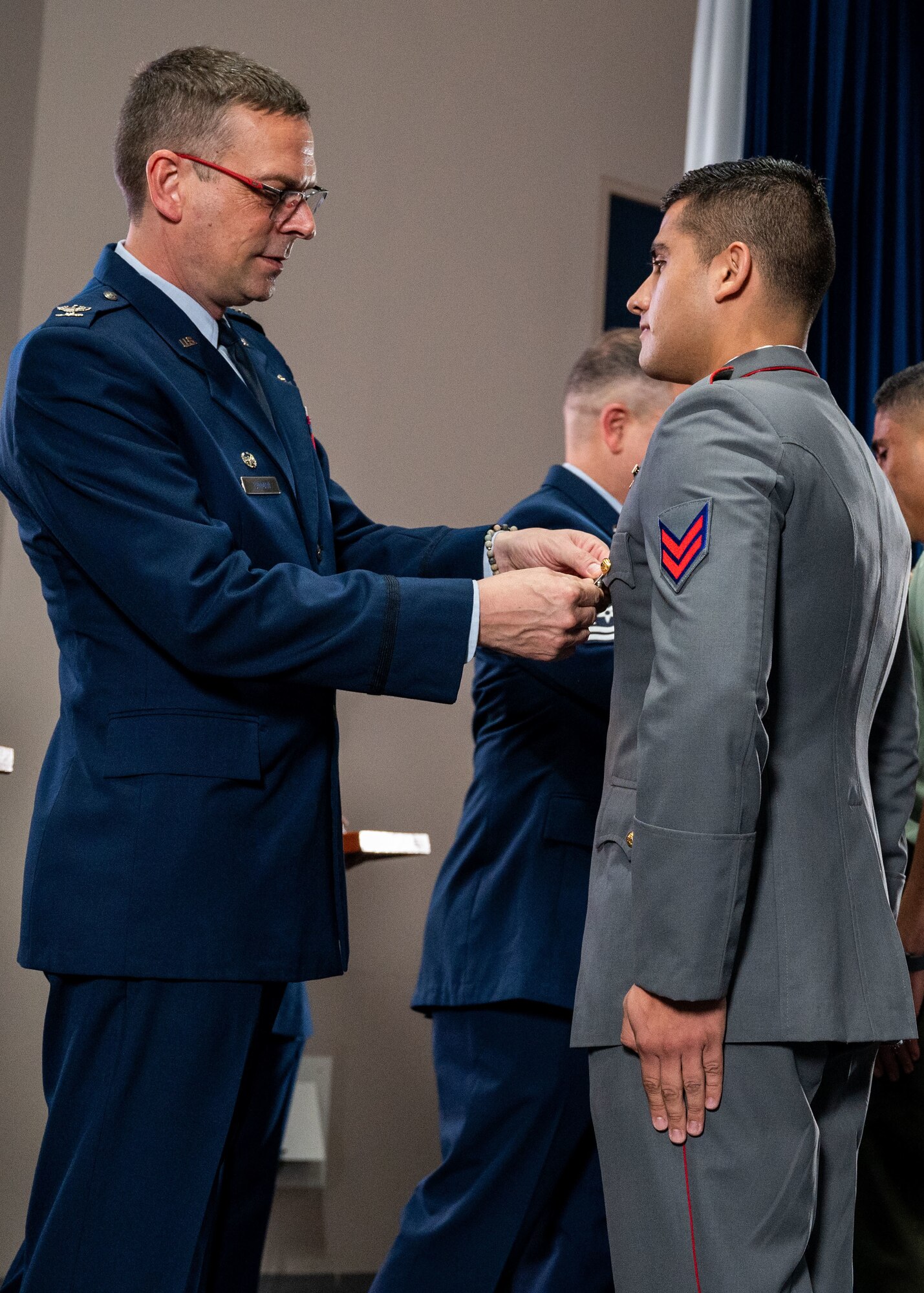 Col. Bryan Tuinman, commandant of the Inter-American Air Forces Academy, pins wings on an international military student during IAAFA’s graduation at Joint Base San Antonio-Lackland Texas, April 24, 2024. Approximately 90 international military students from six partner nations and the U.S. Air Force graduated during the first training cycle of 2024. IAAFA provides instruction in professional military education and leadership, aircrew training and technical courses in Spanish. (U.S. Air Force photo by Vanessa R. Adame)