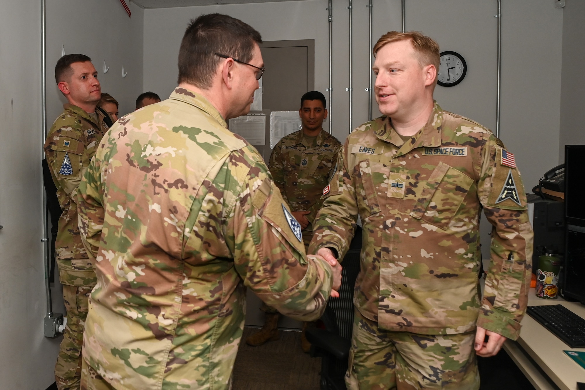 U.S. Space Force Chief of Space Operations Gen. Chance Saltzman, left, presents his coin to U.S. Space Force Specialist 4 Jonathan Eaves, 5th Space Warning Squadron, Detachment 3, during a visit to Osan Air Base, Republic of Korea, May 6, 2024.