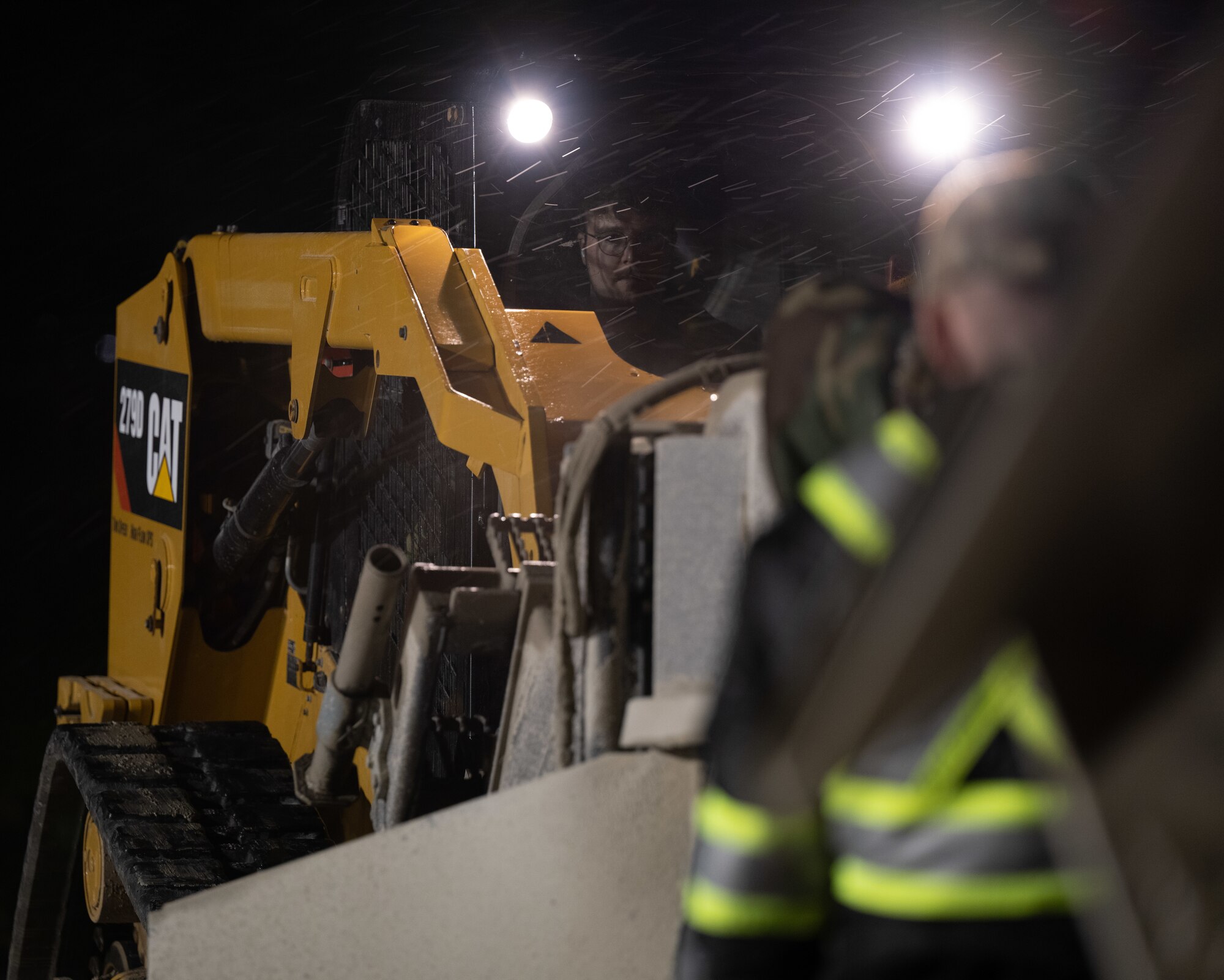 Senior Airman Zachary Donegan operates a compact track loader during Beverly Pack 24-1.