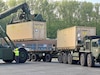 Class VIII medical supply and equipment containers are loaded onto Army line-haul transporters at the Dülmen Army Prepositioned Stocks-2 worksite to be convoyed from Dülmen to Baumholder, Germany, for DEFENDER 24. For the first time in Army medicine history, an APS-2 field hospital was activated and issued, and for the first time in APS-2 history, an Equipment Configuration and Hand-off Area was established at Dülmen to support this mission.