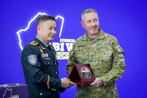 Brig. Gen. B. Uuganbayar, left, deputy director of the Mongolian National Emergency Management Agency, presents a commemorative anniversary plaque to Australian Maj. Gen. Scott Winter, deputy commanding general - strategy and plans for the U.S. Army Pacific, during the Gobi Wolf 2024 opening ceremony at the Governor’s Palace in Choibalsan, Mongolia, May 7, 2024. Gobi Wolf is an annual joint exercise coordinated by the Mongolian National Emergency Management Agency and U.S. Army Pacific that focuses on interagency coordination within Mongolia, as well as foreign humanitarian assistance during a large-scale natural disaster.