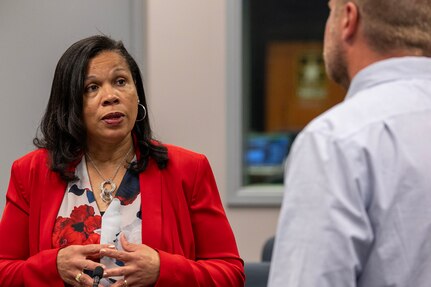 Marlena Walker, U.S. Army Forces Command Resource Management financial management analyst, talks with Dan Rodgers, U.S. Army Financial Management Command Army Financial Servies contract and commercial pay action officer, during the U.S. Army Financial Management Command's Theater Finance Support Update at the Maj. Gen. Emmett J. Bean Federal Center in Indianapolis May 1, 2024. The TFSU focused on synchronization, data sharing, best practices, and coordination for finance and comptroller units rotating into the U.S. Central Command and European Command Areas of Responsibility. (U.S. Army photo by Mark R. W. Orders-Woempner)